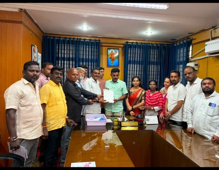 Temple committee members submitting a petition to the SHIMUDA president for an entrance arch at Kote Anjaneya Temple, Shivamogga
